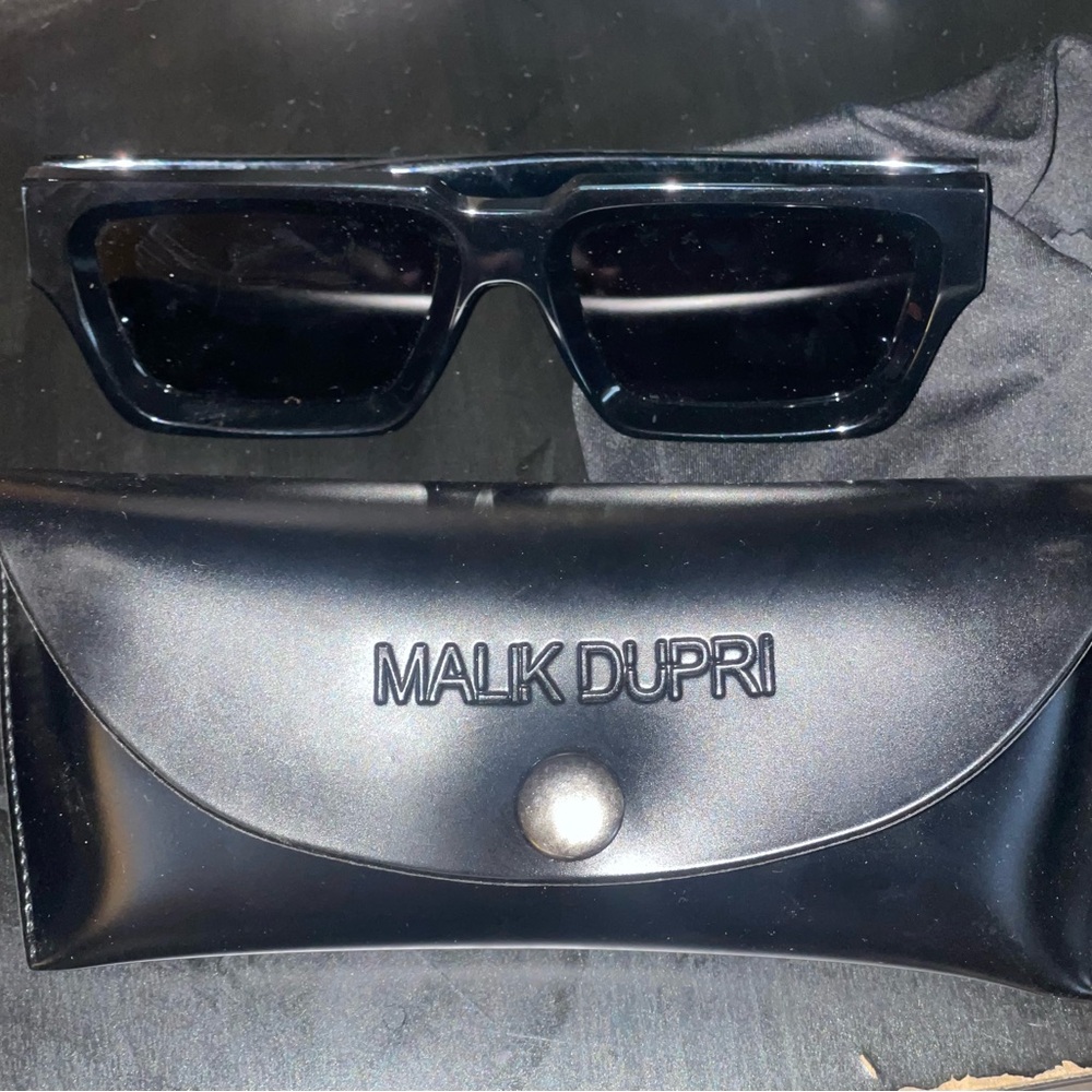 Men’s black sunglasses with a dark tint
